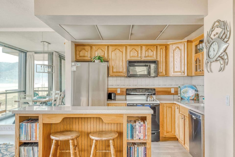 Functional kitchen providing essential appliances creating a clean and practical cooking space.