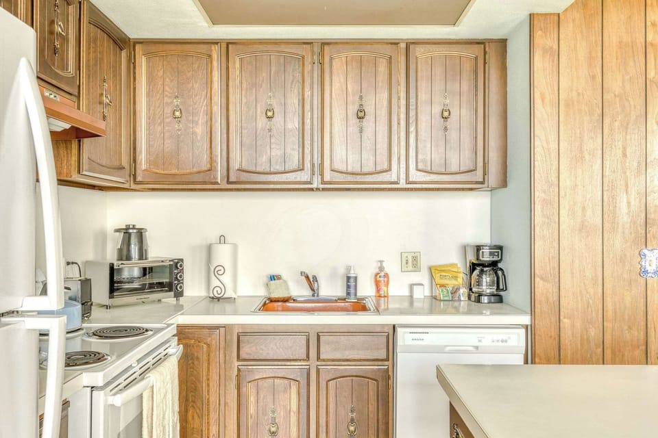 Functional kitchen providing essential appliances creating a clean and practical cooking space