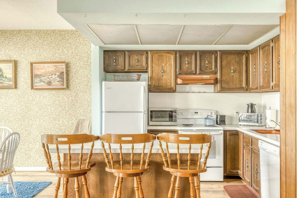 Whip up meals in our fully equipped kitchen! Complete with essential appliances and bar seating for quick bites.