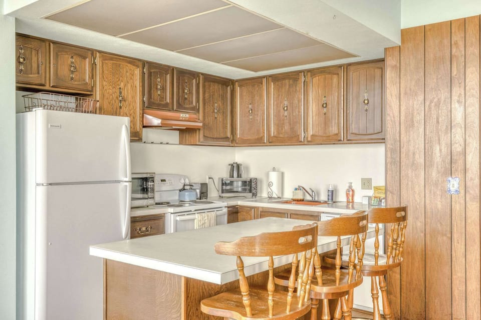 Functional kitchen providing essential appliances creating a clean and practical cooking space