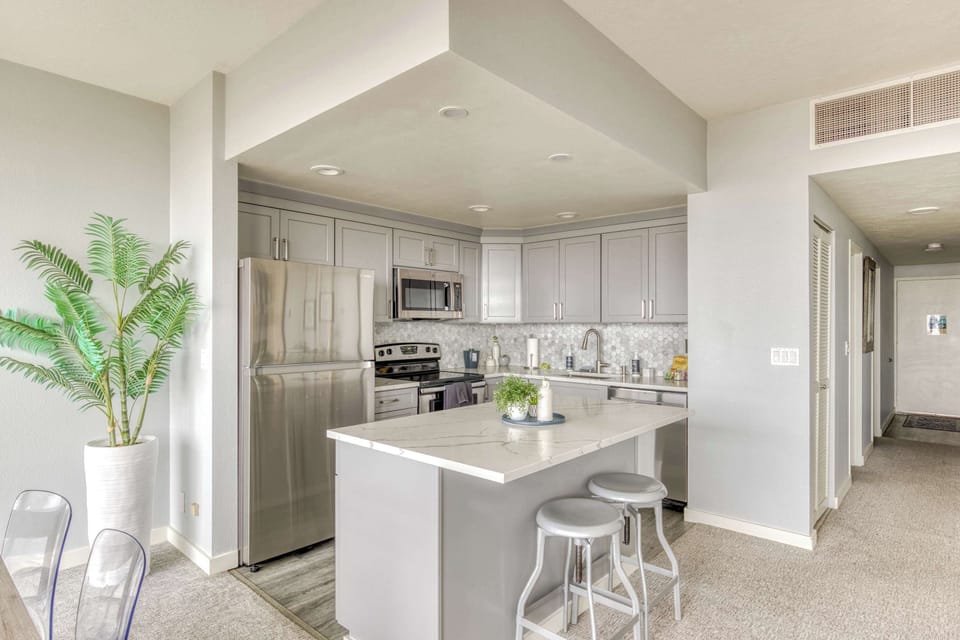 Cook with ease! Our functional kitchen with essential appliances provides a clean, practical cooking space.