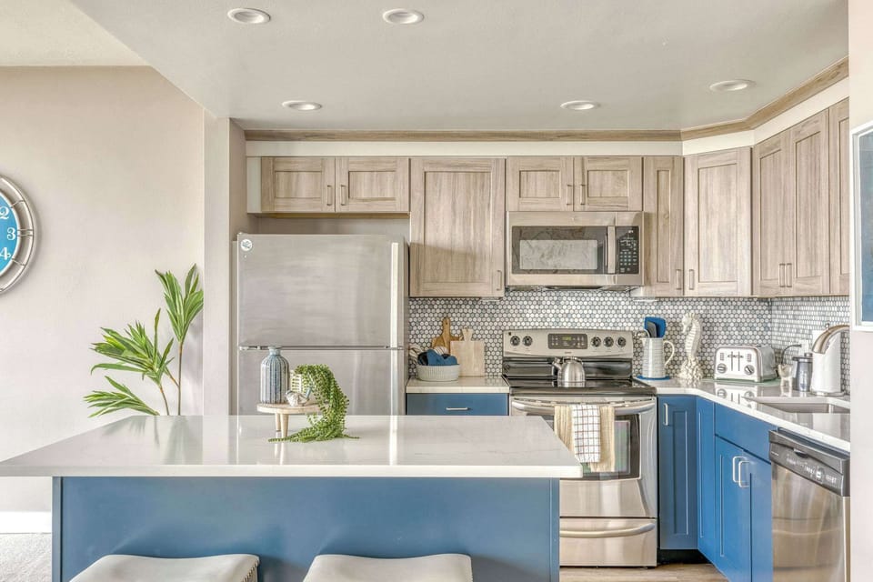 Whip up a feast! Our stylish, fully-equipped kitchen with a fun backsplash is ready for your culinary adventures.