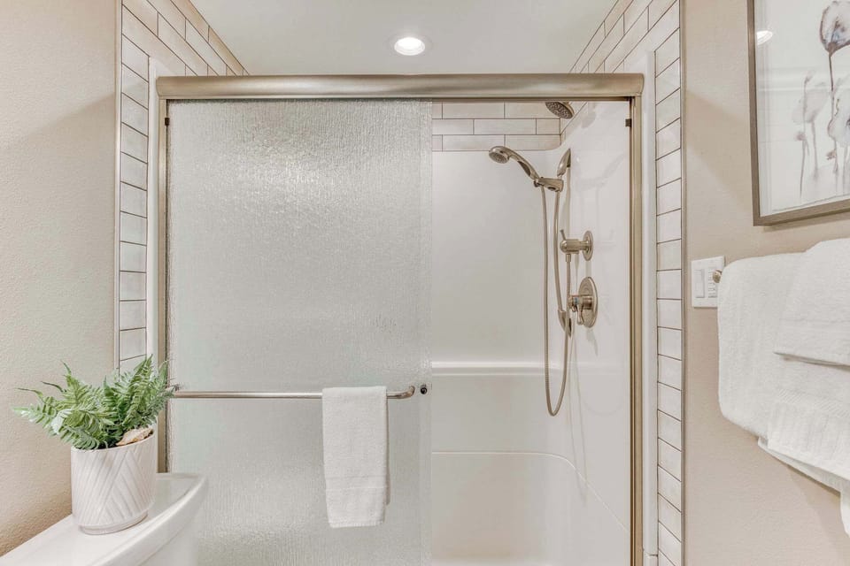 Dedicated primary bathroom with spacious walk in shower to relax and wash the day away.