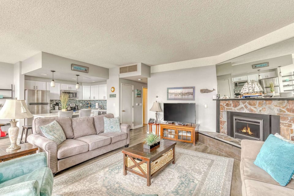 A modern, open-concept living space with large windows, cozy seating, a spacious dining area, and a bright, inviting atmosphere.