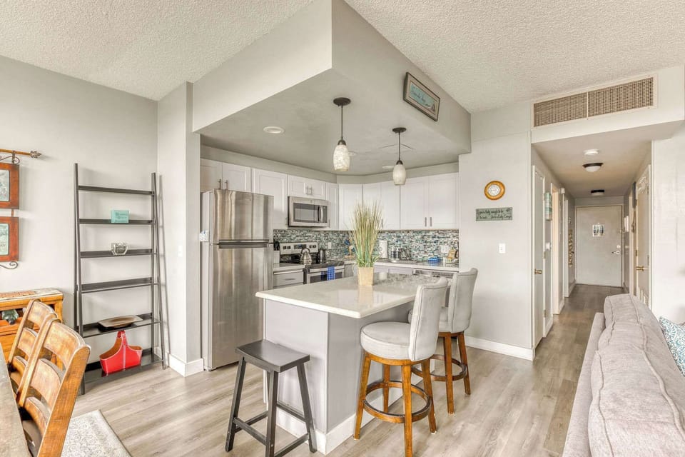 Open-concept living at its best! Our modern kitchen flows seamlessly into dining and living areas for easy enjoyment.
