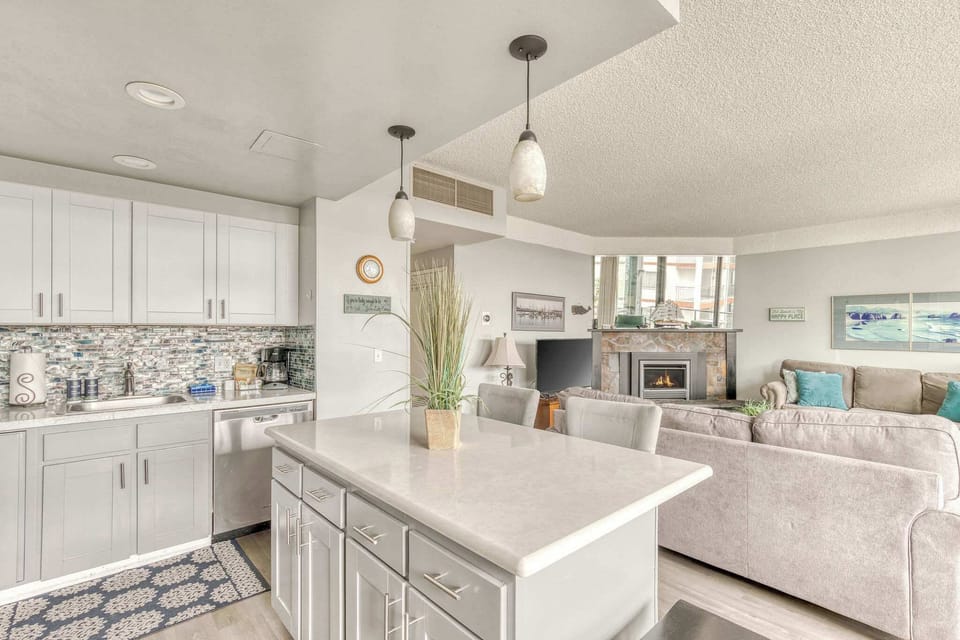 The island provides ample space to prep while also providing seating for company. Open floor plan means no one is missing out on the festivities!