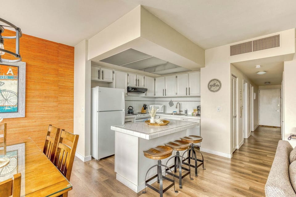 Functional kitchen providing essential appliances creating a clean and practical cooking space.