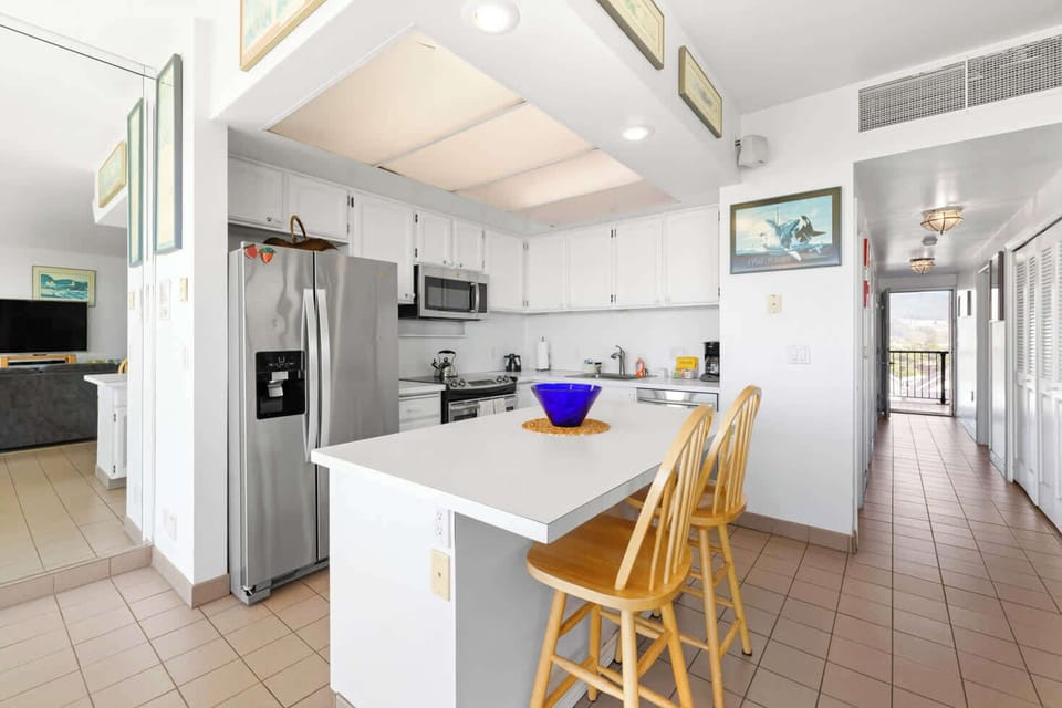 Functional kitchen providing essential appliances creating a clean and practical cooking space.