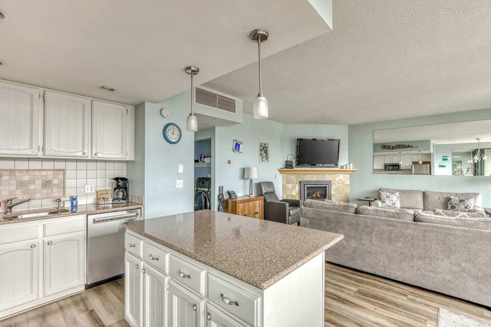 Your social hub! Island for prepping, open living for fun. Fireplace for cozy evenings. 