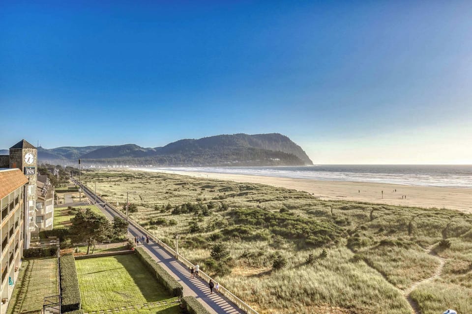 Panoramic perfection awaits! Wake up to views of the Promenade and beach, with sweeping scenes of the coastline, sand dunes, and distant mountains. Your serene escape.