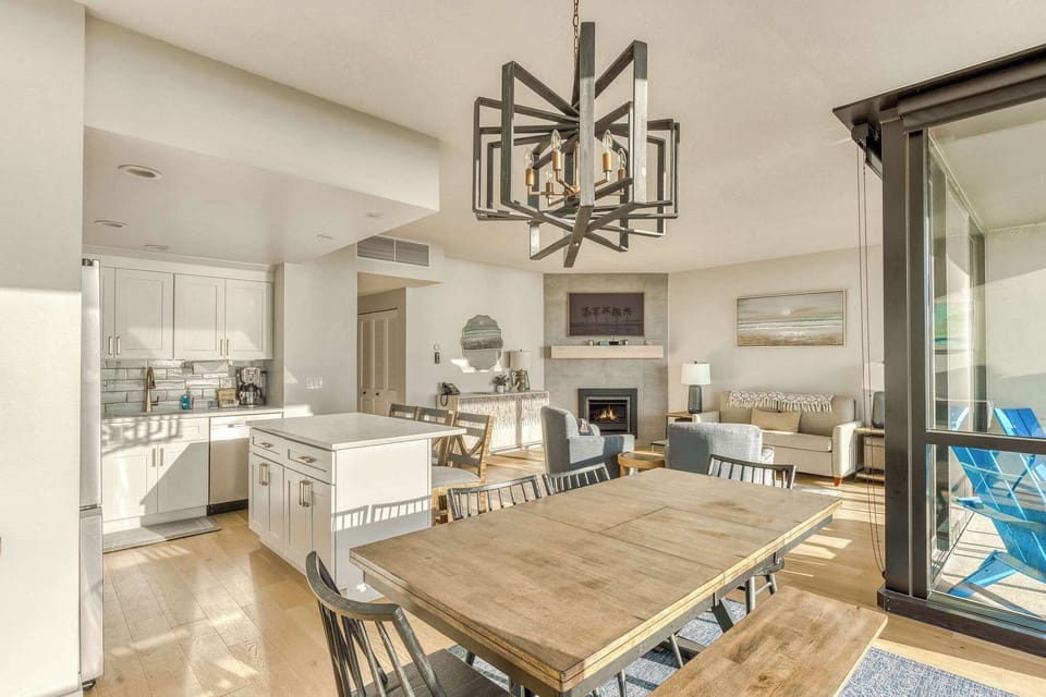 Gather, cook, and unwind in this beautifully integrated living space. Complete with a stunning kitchen, ample dining, and a cozy fireplace, it's ideal for a memorable stay.