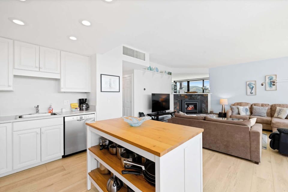 The island provides ample space to prep while also providing seating for company. Open floor plan means no one is missing out on the festivities!