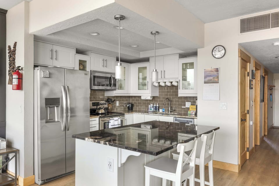Functional kitchen providing essential appliances creating a clean and practical cooking space. 