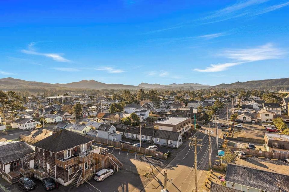 Watch the day begin and end with sweeping mountain views and a peaceful town below.