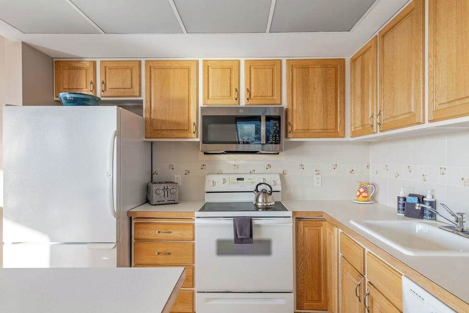 Cook with ease in this bright kitchen featuring generous counter space and everything you need for meals.