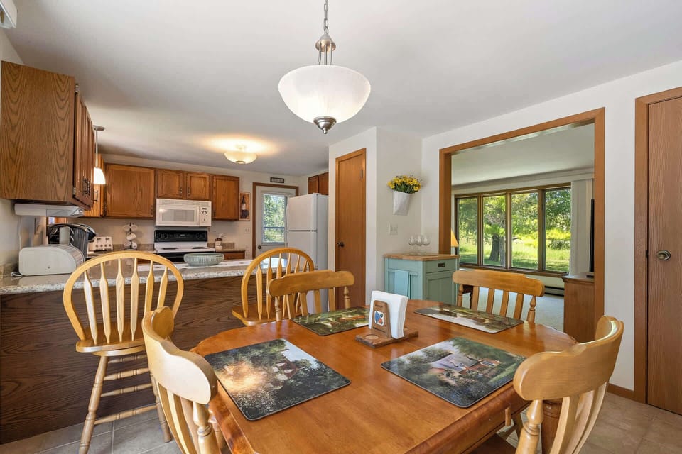 Dining table includes seating for 4 and island includes seating for 2