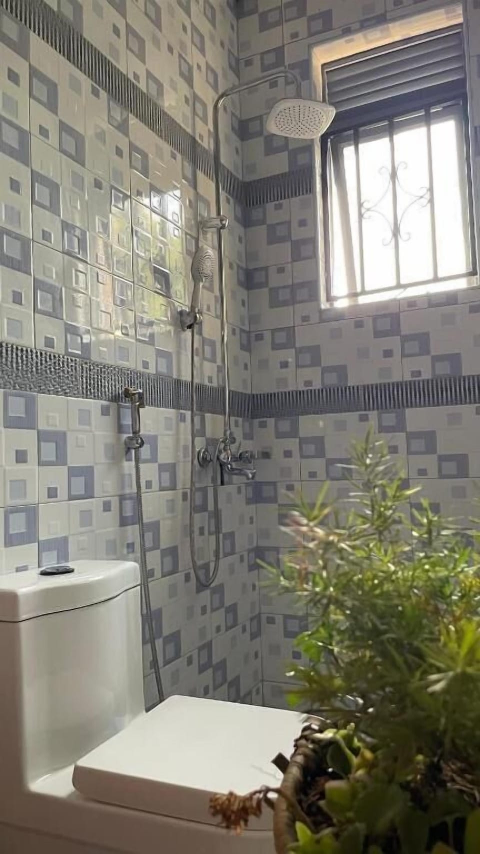 Shower, rainfall showerhead, designer toiletries, hair dryer
