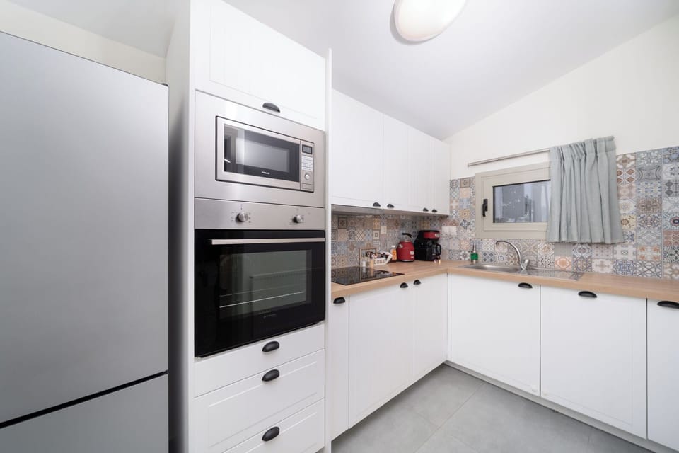 Luxury House | Private kitchen | Espresso maker, coffee/tea maker, electric kettle, dining tables