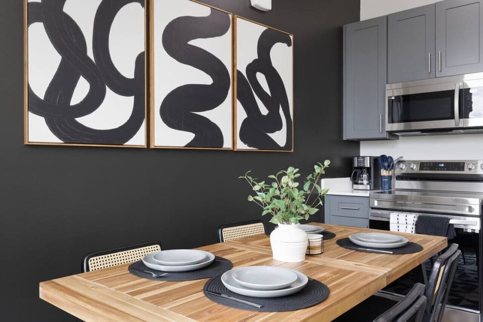 Elegant dining area with a large table and comfortable seating, perfect for gathering with family and friends for a meal.