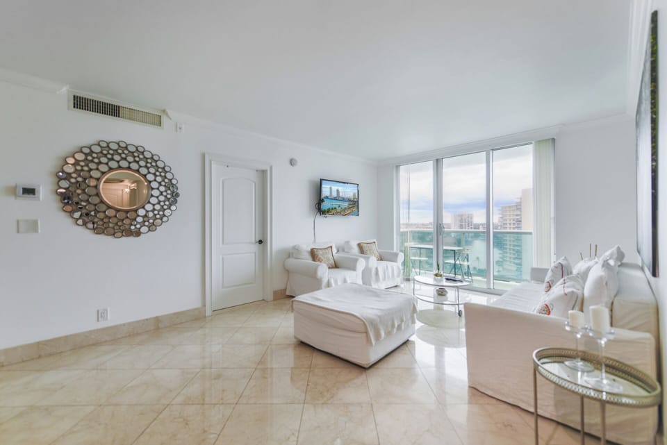 Apartment, Balcony, City View | Living area | 50-inch Smart TV with satellite channels
