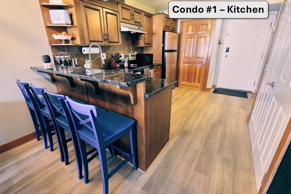 Fully stocked kitchen with all cooking amenities and ample seating
