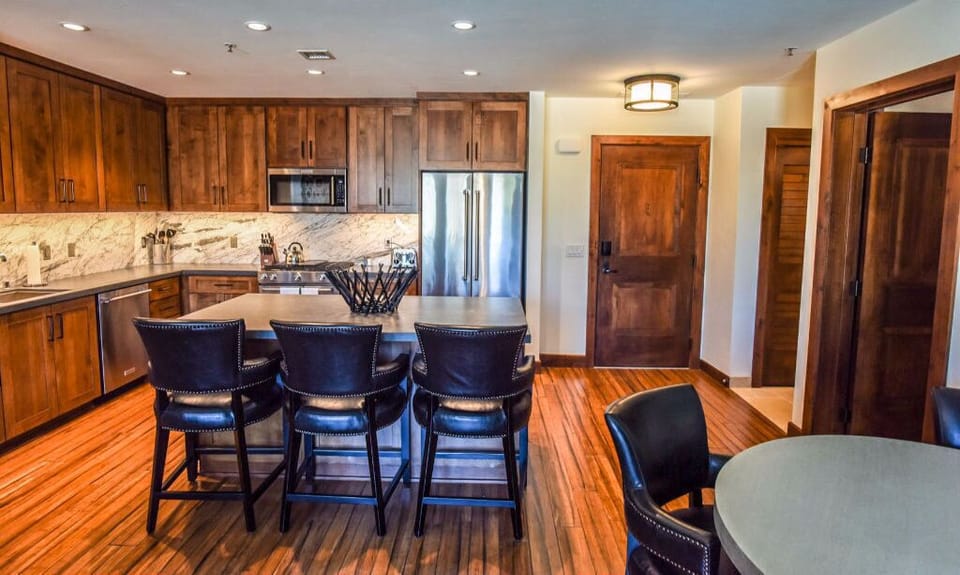 Cook and entertain in this large kitchen, featuring a breakfast bar, modern appliances, and plenty of counter space for meal preparation.