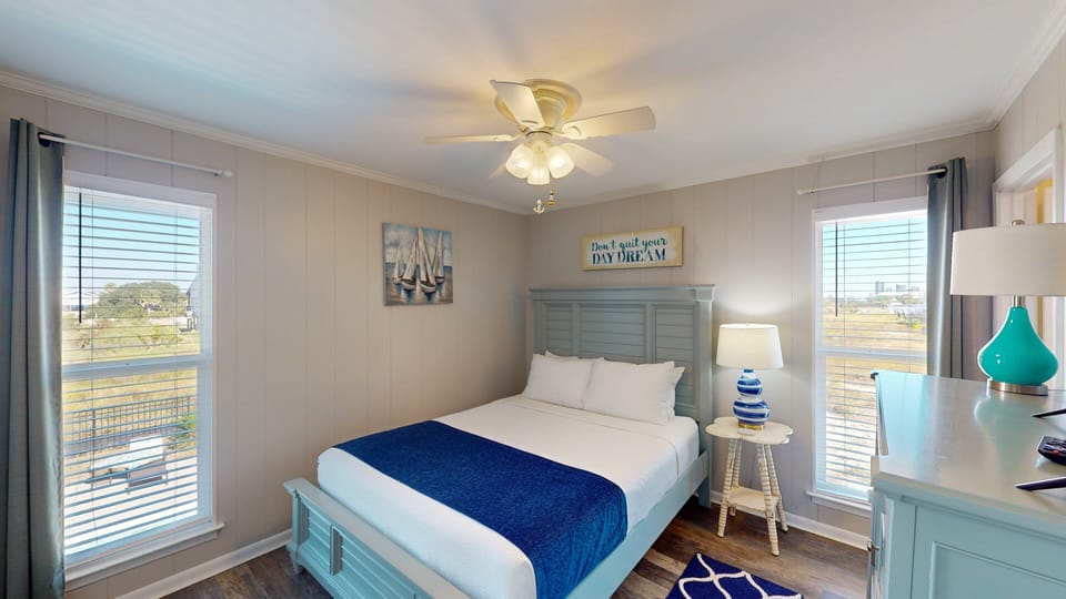 The soothing, beach-inspired decor makes for a relaxing space to rest and recharge while a comfortable queen mattress and fine linens prepare a cozy resting place for a peaceful night's sleep.