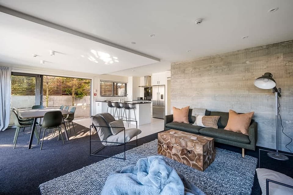 Comfort Meets Elegance
Unwind in this stylishly furnished living room, complete with plush seating, tasteful décor, and a cozy ambiance. Enjoy breathtaking views of the town and the serene mountains from the comfort of your couch.