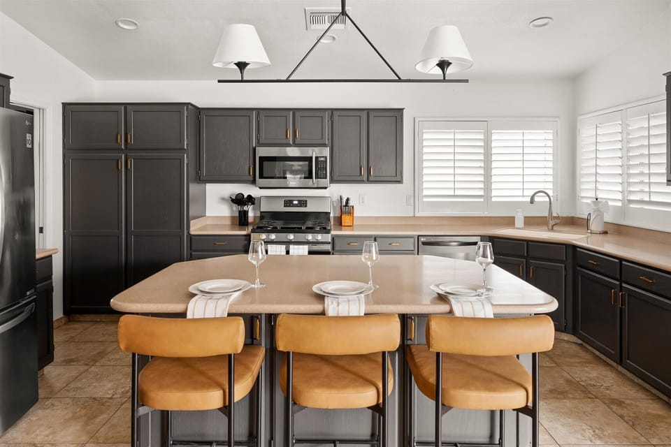 Gather around our center island with three stylish bar stools, ideal for casual meals and lively chats.