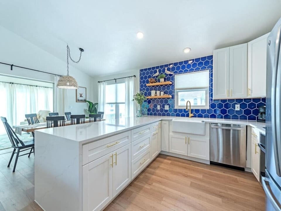 Gorgeous kitchen with bold tile, tons of counter space, and everything you need