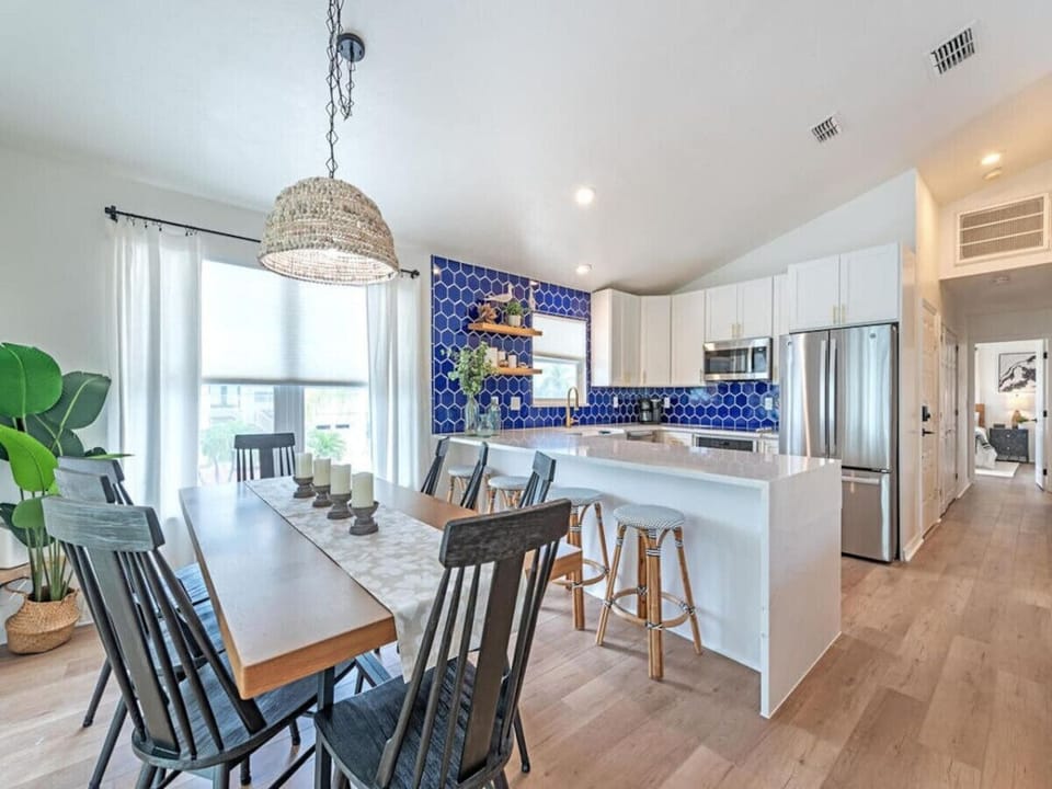 Dine in style just steps from the kitchen, with coastal light streaming in