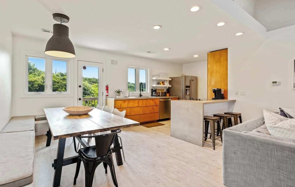 Open concept dining area and kitchen with breakfast bar seating