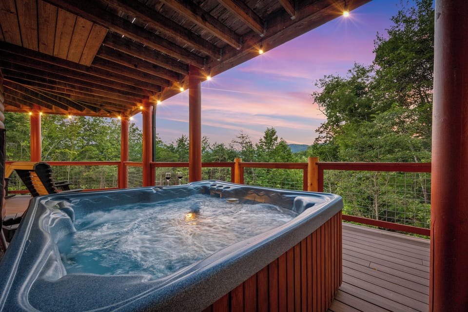 Private hot tub on deck with relaxing mountain scenery