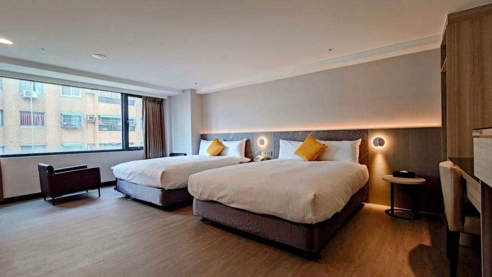 Classic Quadruple Room, City View | Desk, laptop workspace, blackout drapes, soundproofing