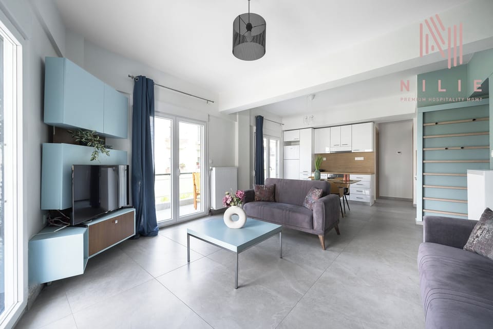 Family Apartment, Balcony, City View | Living area | Flat-screen TV
