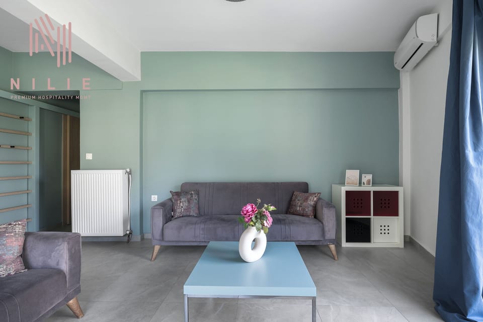 Family Apartment, Balcony, City View | Living area | Flat-screen TV