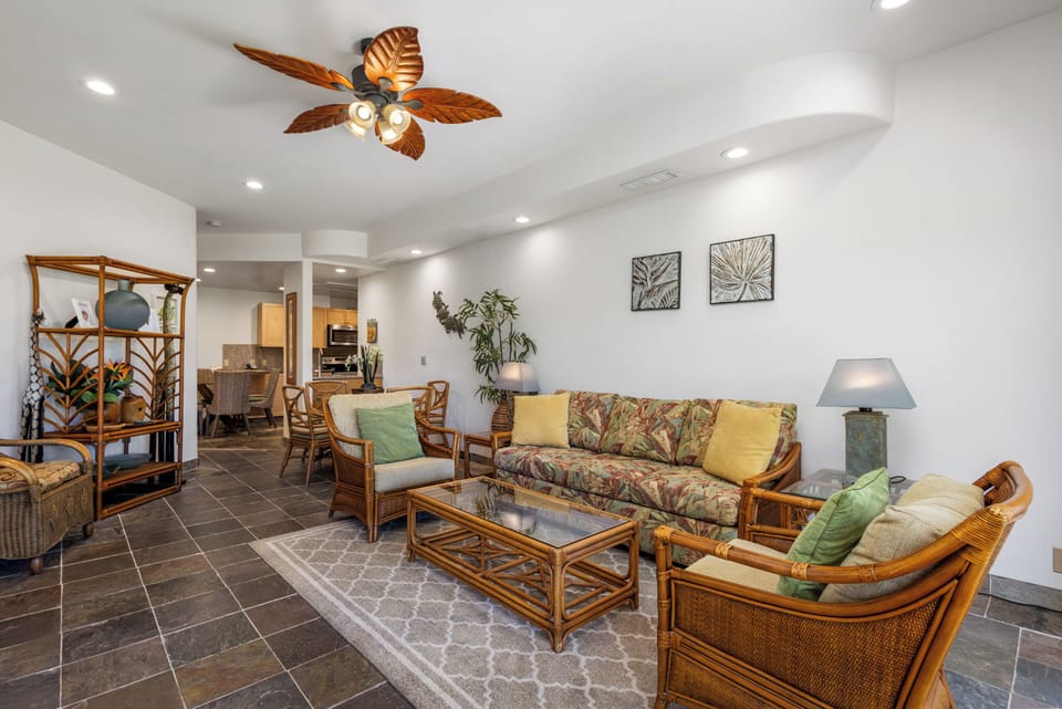 Settle into breezy tropical comfort with island-inspired décor, plush seating, and a stylish ceiling fan that keeps you cool while you unwind in your vacation haven.