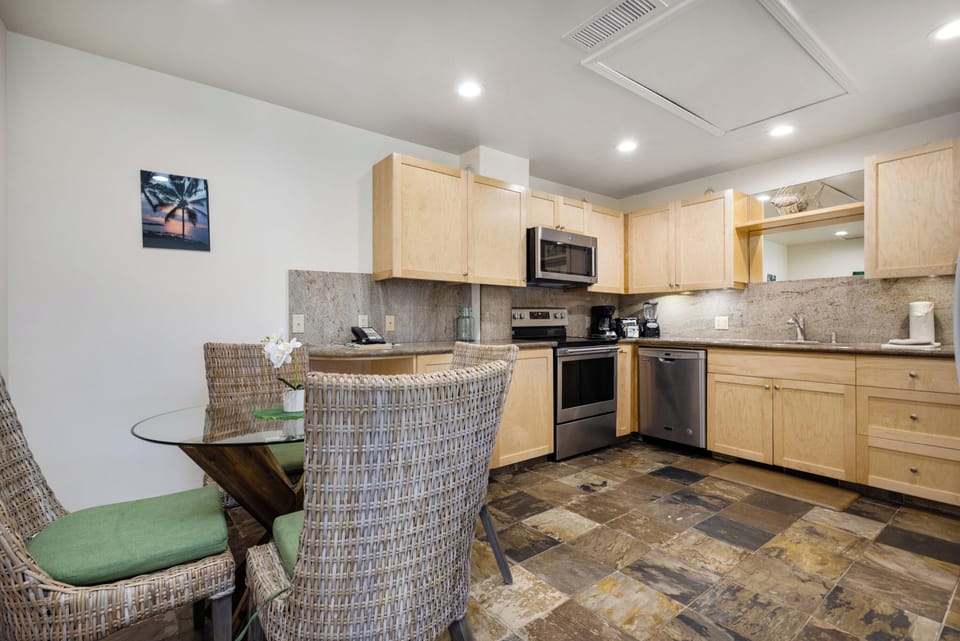 Your fully equipped kitchen and dining space invite you to cook meals together and gather around the table, blending modern convenience with coastal charm in this welcoming retreat.