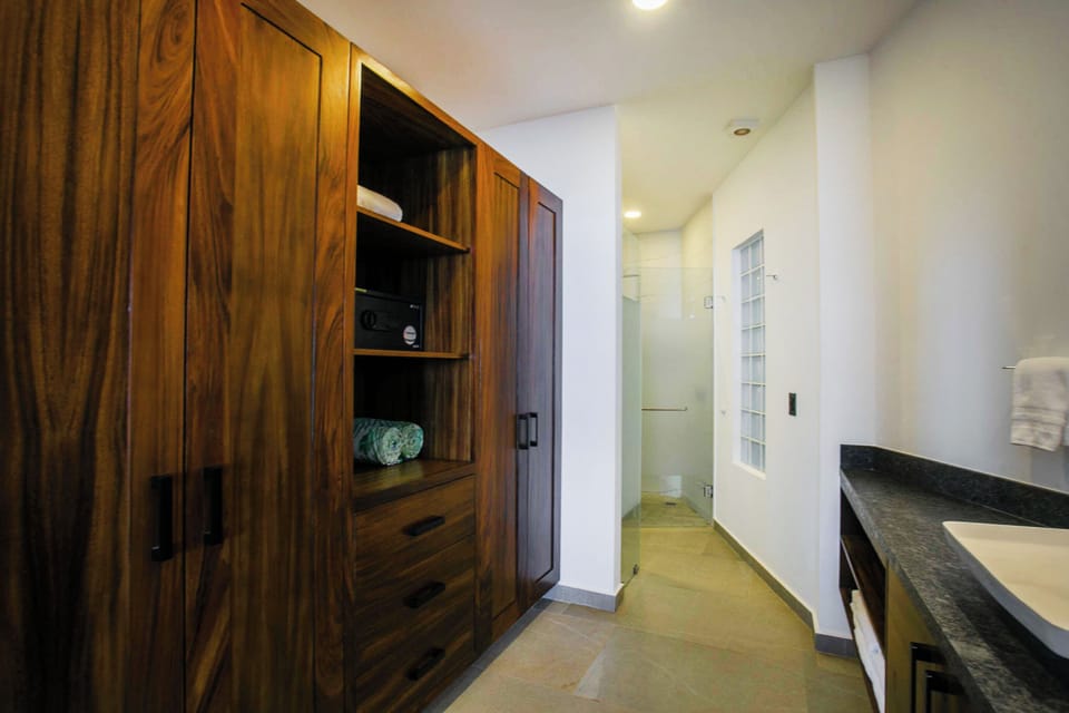 Expansive master bathroom with ample closet space and stocked with quality towels
