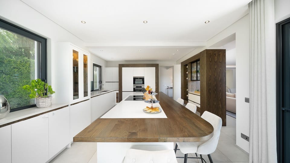 This bright and spacious kitchen is perfect for culinary creativity, offering a sleek island, modern appliances, and a cozy breakfast bar. 

#LuxuryKitchen #ModernLiving #Algarve #Portugal
