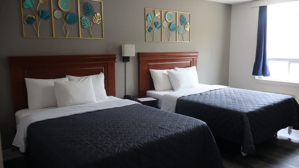 Premium bedding, pillowtop beds, blackout drapes, iron/ironing board