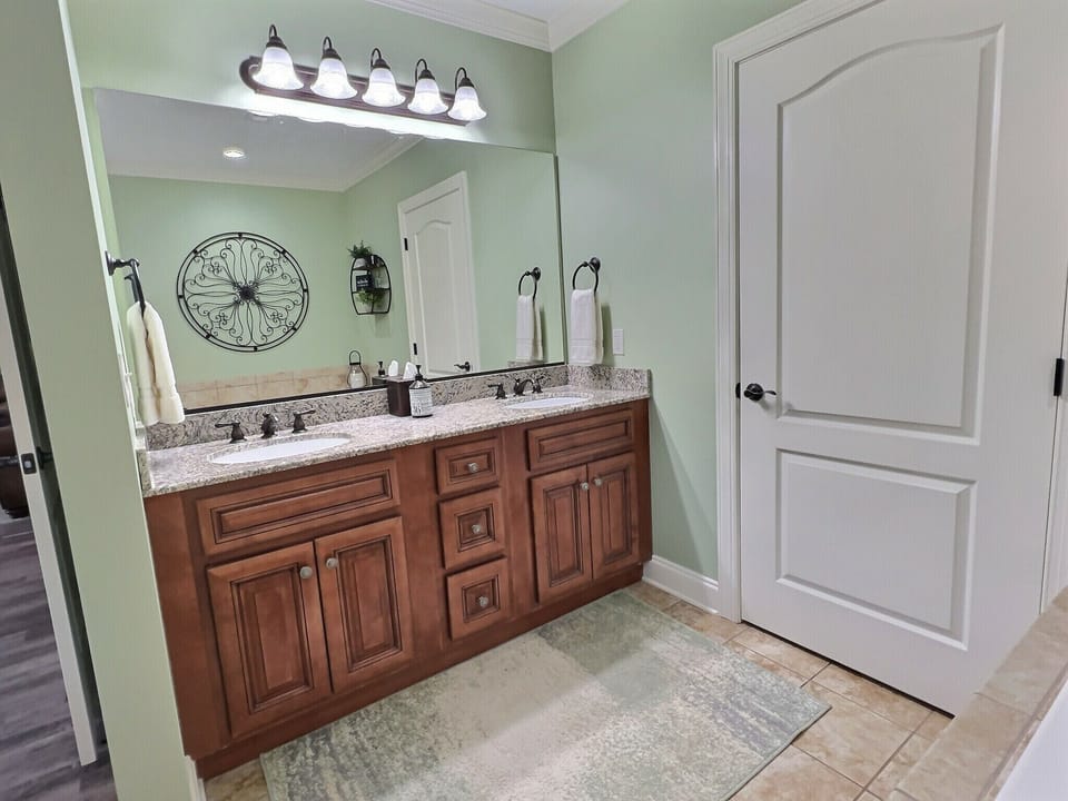 Primary bathroom with a double vanity and generous counter space.