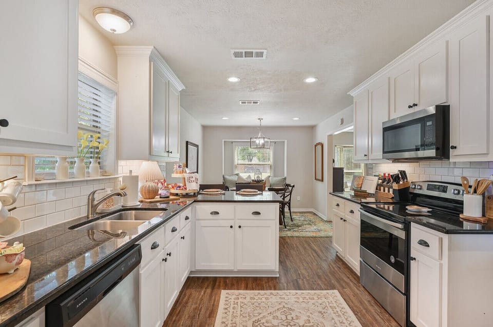 A fully stocked kitchen with modern stainless-steel appliances, ready for any culinary adventure.