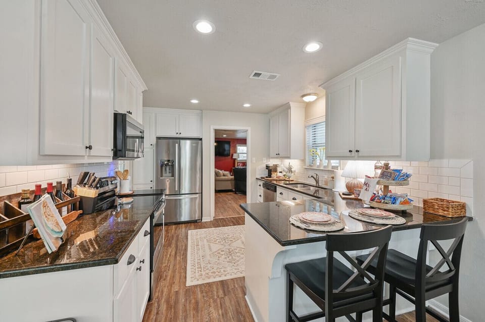 The full kitchen features bar seating, keeping everyone connected in the conversation.