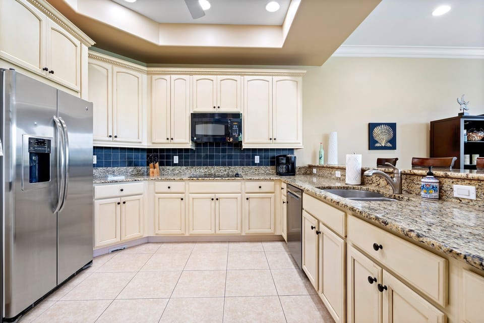 Kitchen with a wrap-around counter with every utensil and cooking need