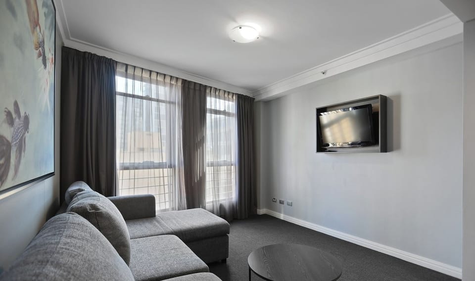 Spacious living area with a sofa bed and warm homey feel