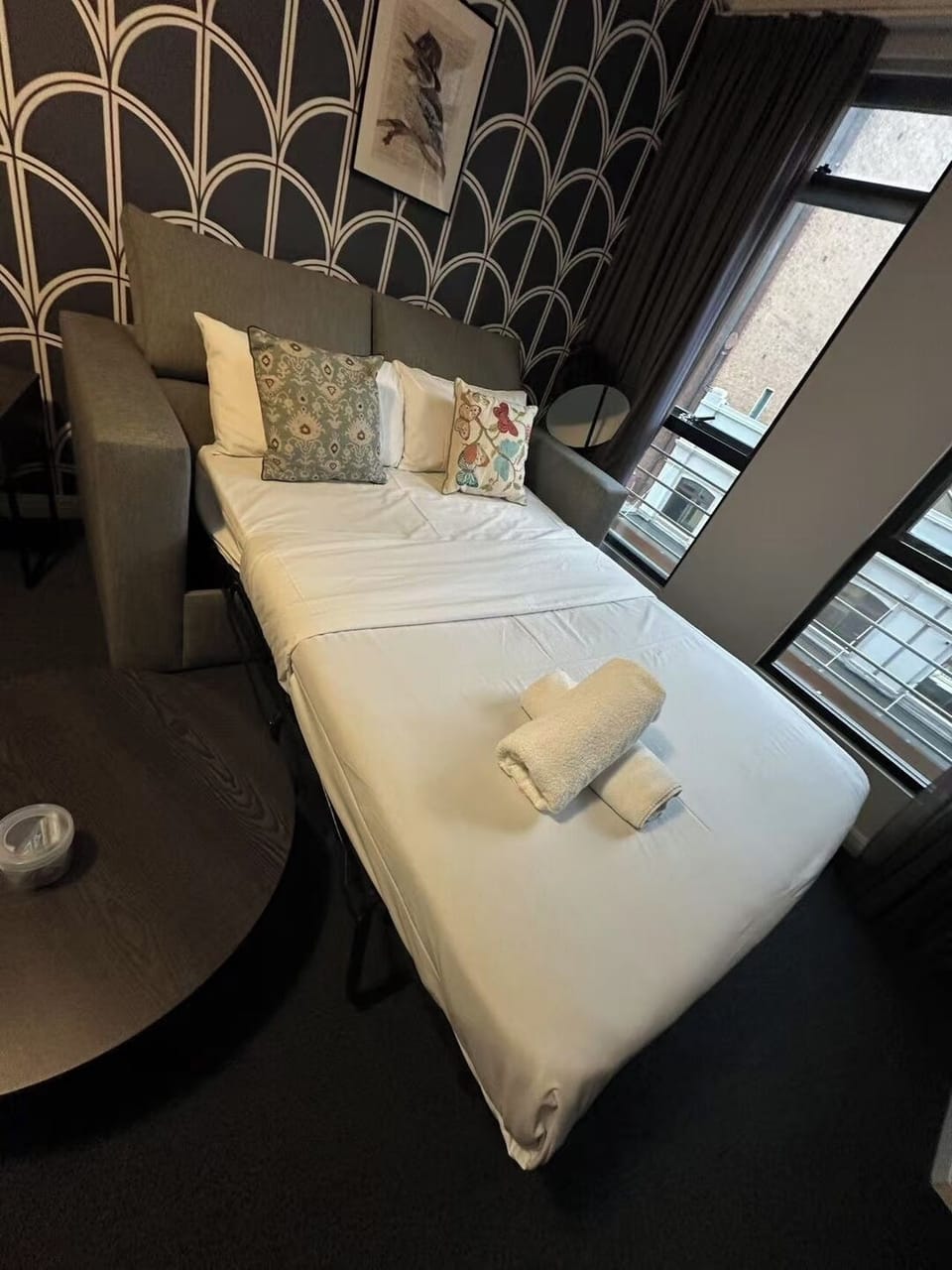 Spacious living area with a sofa bed and warm homey feel