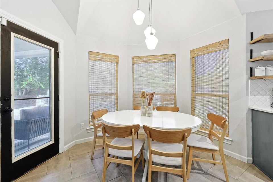 Bright family dining room with 6 seats and access to the patio