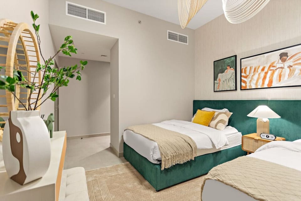 Chic Twin Room: Relax in vibrant decor with artful touches and ambient lighting for your stay!