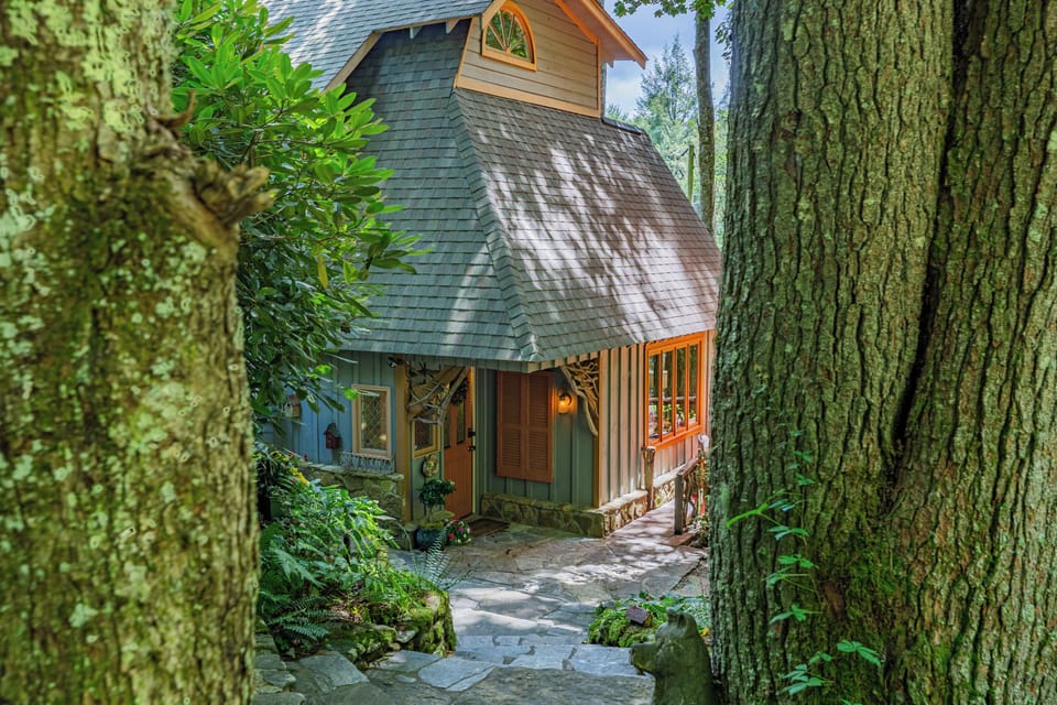 Entrance of TreeTops Cabin with custom stone walkway and steps. 